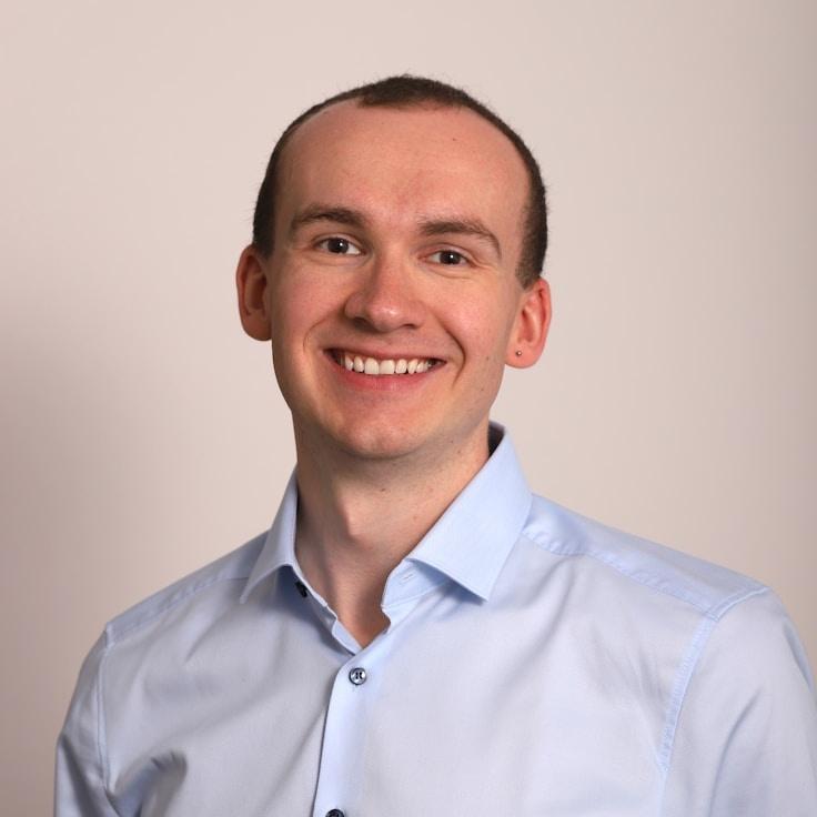 Liam Chen, Client Relations Director, discussing corporate gifting strategy with business clients